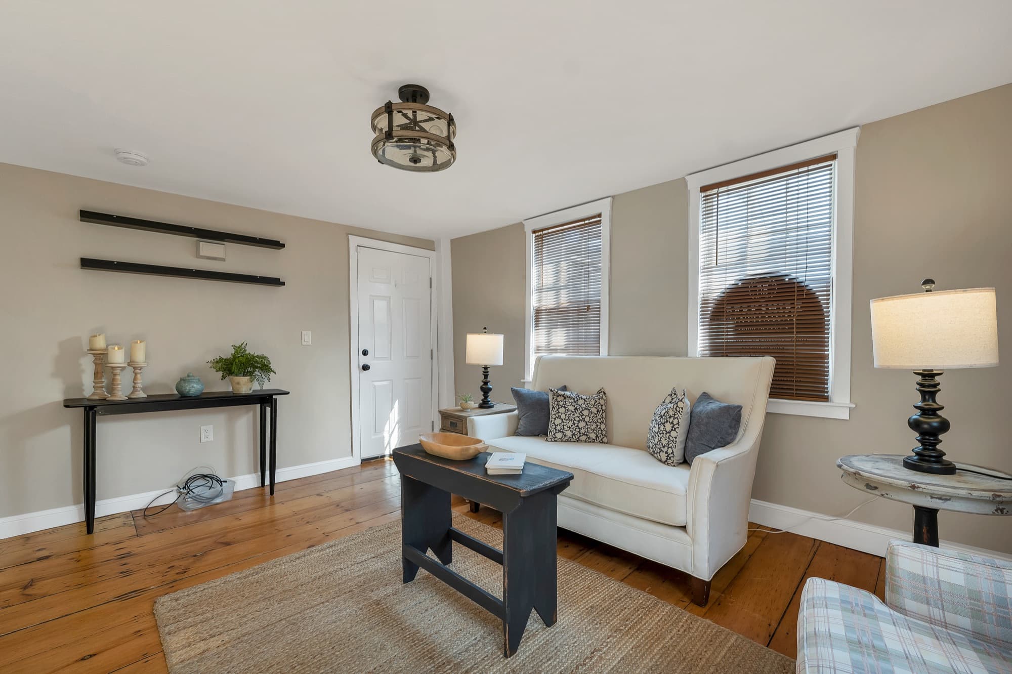 Staged living room looking toward the front entry