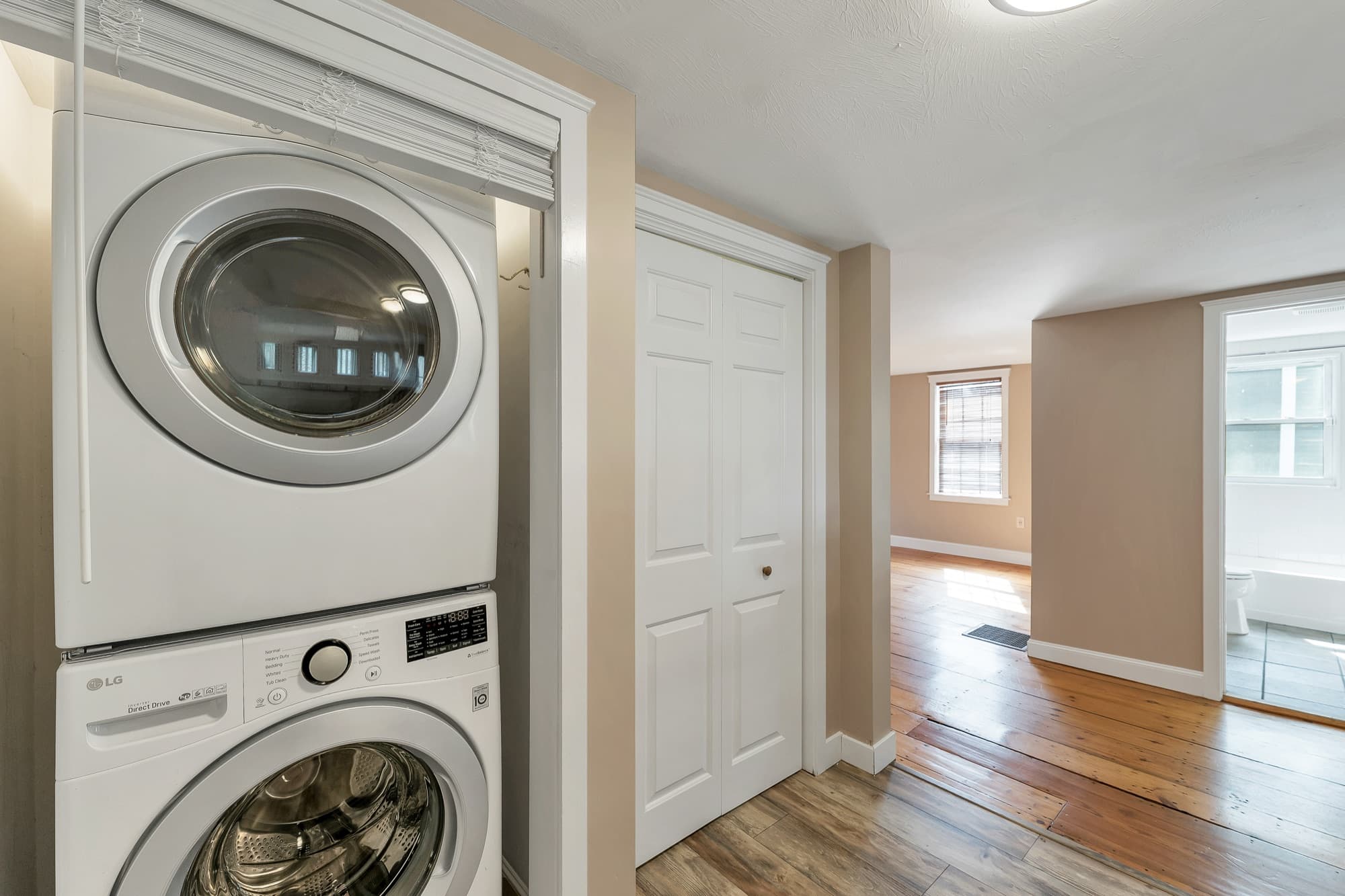 In-unit stacked washer and dryer