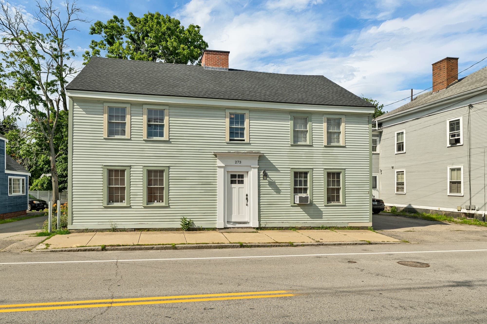 Front exterior of the North Mill Pond Condominium building at 273 Maplewood Avenue